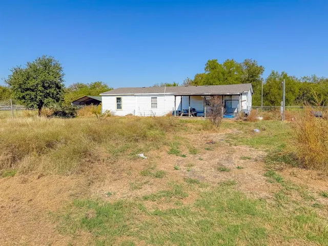 a view of swimming pool with a yard