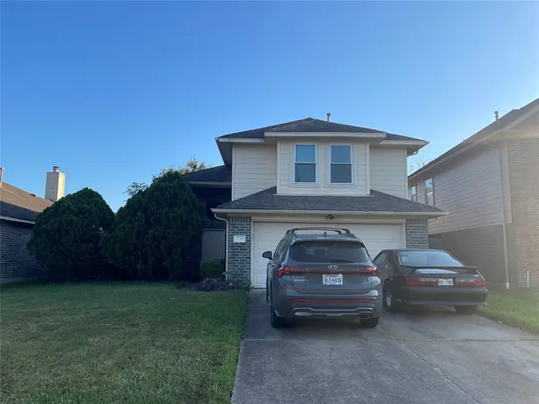 a car parked in front of a house