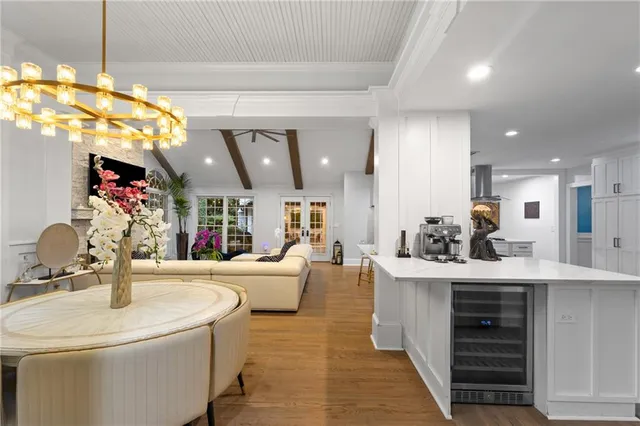 a kitchen with kitchen island granite countertop a sink counter top space and stainless steel appliances