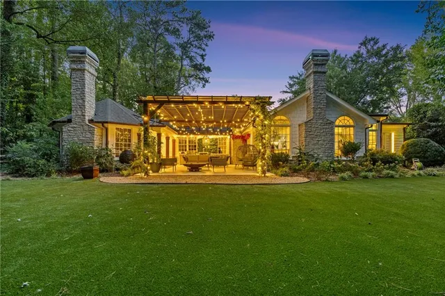 a view of a house with a big yard
