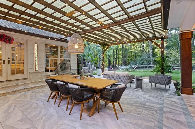 a front view of a house with a yard and shrubs