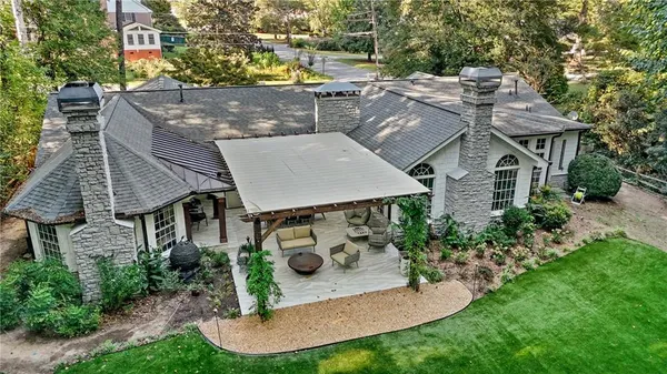 an aerial view of a house with a yard