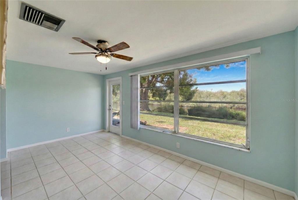 4112 Hampton Drive New Port Richey, FL 34652 - Photo 16 of 73 a view of an empty room with a window