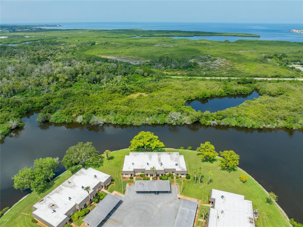 4112 Hampton Drive New Port Richey, FL 34652 - Photo 36 of 73 an aerial view of a house with a lake view