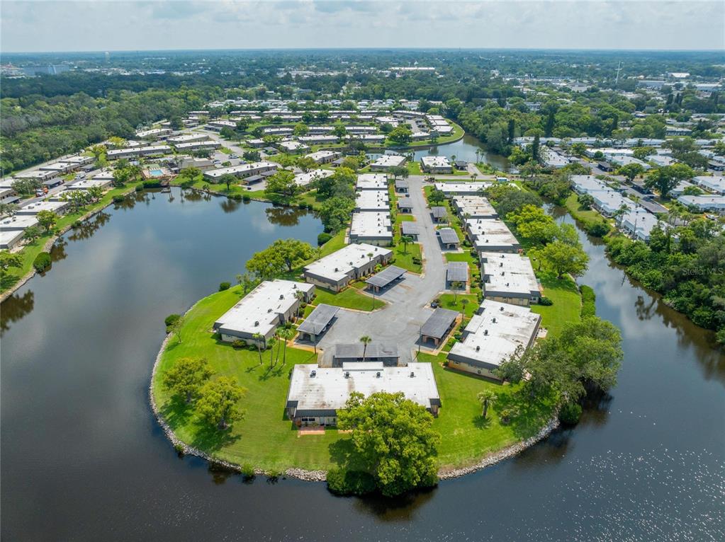 4112 Hampton Drive New Port Richey, FL 34652 - Photo 42 of 73 an aerial view of a house with a lake view