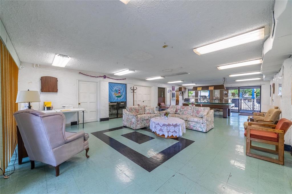 4112 Hampton Drive New Port Richey, FL 34652 - Photo 62 of 73 a living room with furniture and a flat screen tv