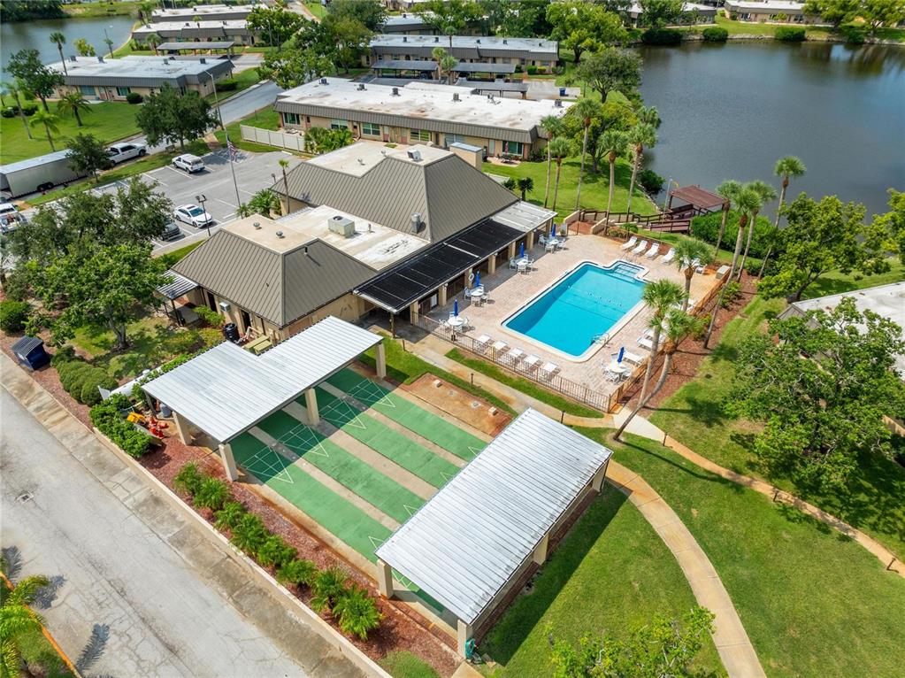 4112 Hampton Drive New Port Richey, FL 34652 - Photo 73 of 73 an aerial view of a house with a garden and lake view