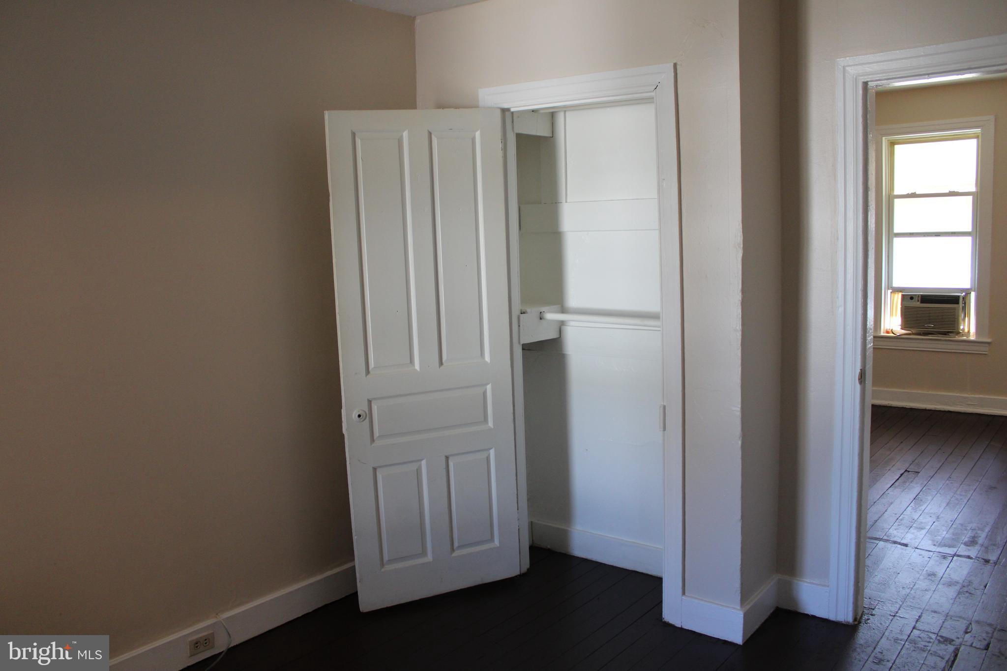 103 West 6th Avenue York, PA 17404 - Photo 13 of 19 an entryway with wooden floor and cabinet