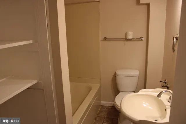 a bathroom with a sink and a toilet