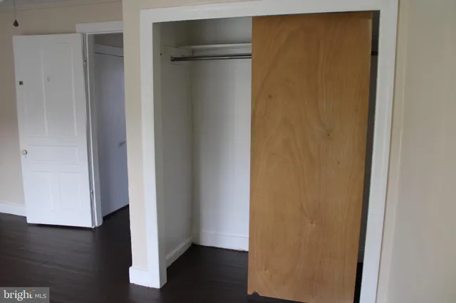 a view of front door with wooden floor
