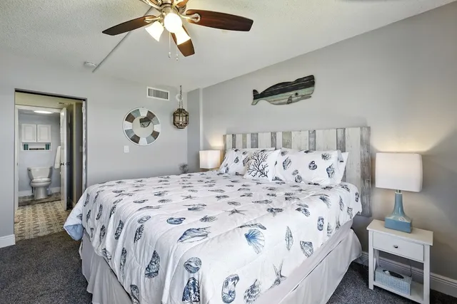 a bedroom with bed and a window