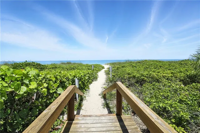 a view of a swimming pool and lounge chair
