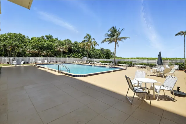a view of a park with palm trees