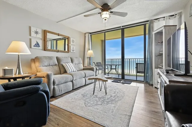 a living room with furniture and a large window