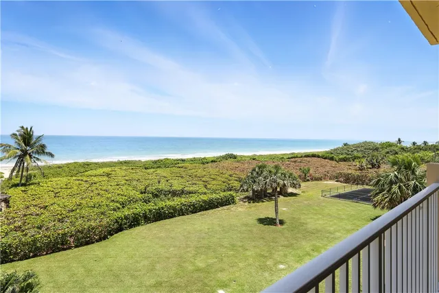 a view of a two chairs in a balcony