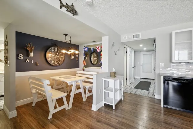 a view of a livingroom with furniture and a wooden floor