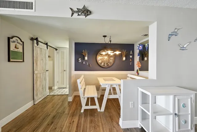 a view of a entryway door with wooden floor