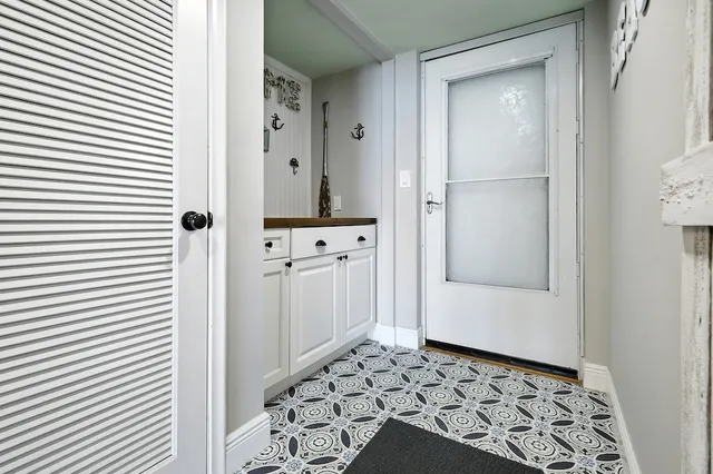 a bathroom with a sink toilet and a mirror