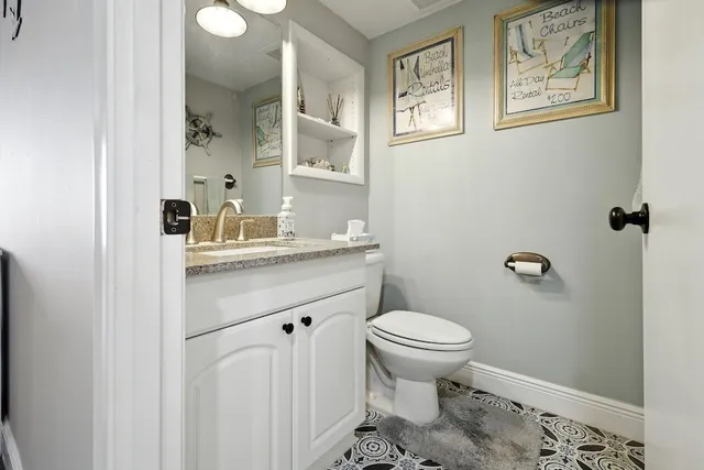 a living room with a couch and a chandelier