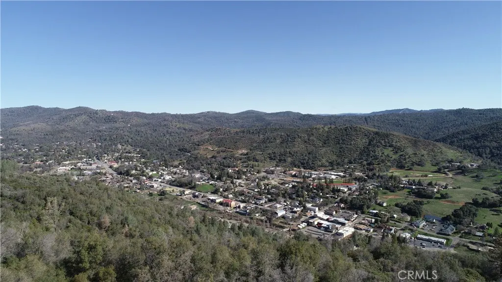 5 Martin Road Edwards, CA 93523 - Photo 7 of 8 a view of a lush green field with mountains in the background