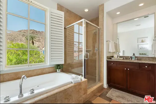 a bathroom with a bathtub and a sink