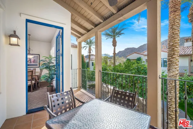 a bedroom with furniture and a large window