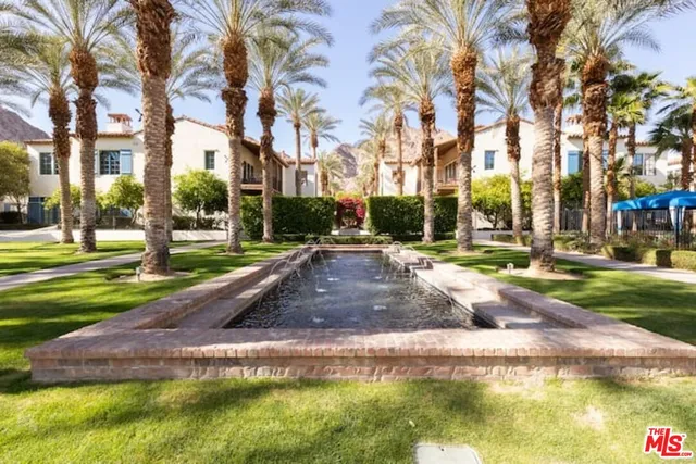 a view of a park with large trees