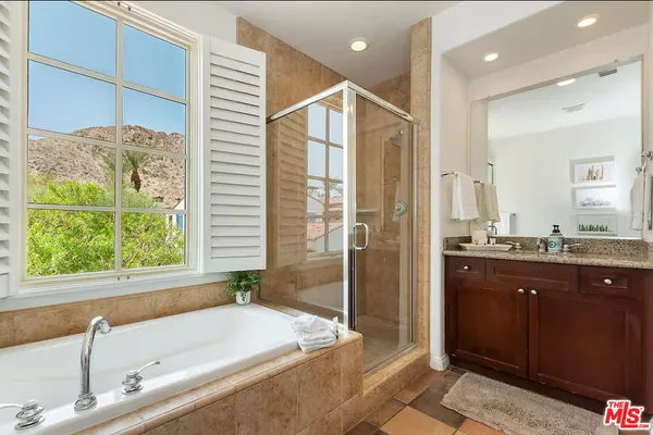 a bathroom with a bathtub and a sink