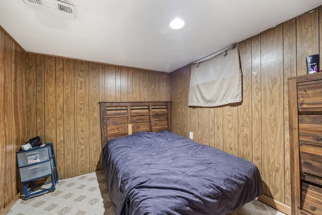 a bedroom with a bed and a view of bathroom