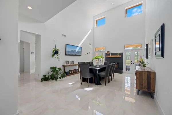 a view of a dining room with furniture and a livingroom