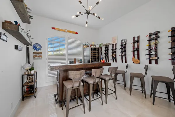 a dining room with furniture and window