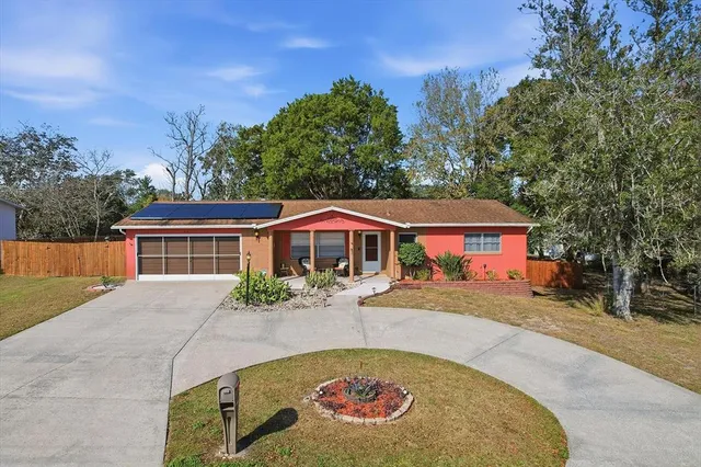 a view of a house with a yard