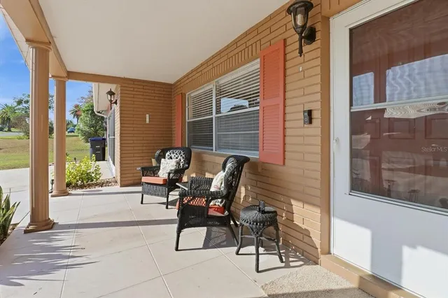 a view of a two chairs in the balcony