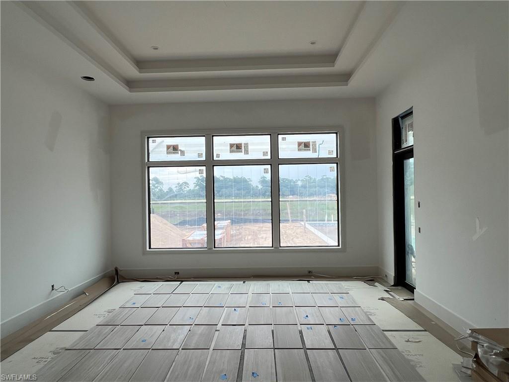 944 Chimney Rock Road Naples, FL 34120 - Photo 5 of 20 a view of an empty room with a window