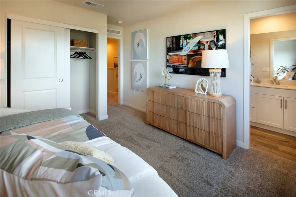 9521 Hannah Way Riverside, CA 92505 - Photo 14 of 20 a bedroom with furniture and mirror