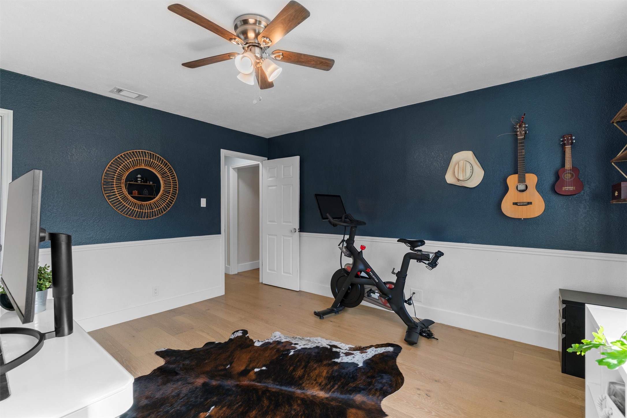 3431 Bliss Spillar Road Manchaca, TX 78652 - Photo 17 of 30 Exercise area featuring wood finished floors and a ceiling fan