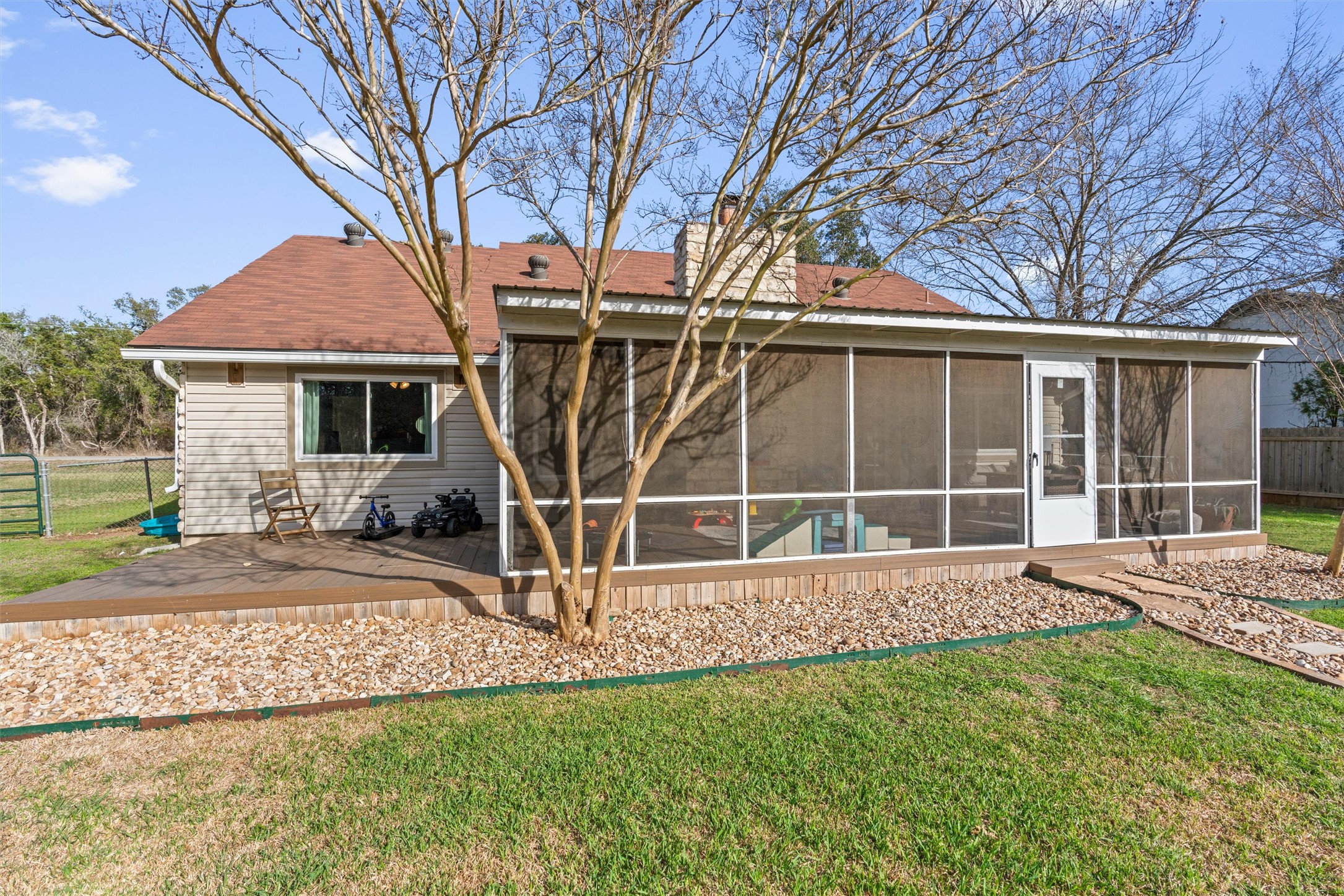 3431 Bliss Spillar Road Manchaca, TX 78652 - Photo 24 of 30 Rear view of house with a sunroom