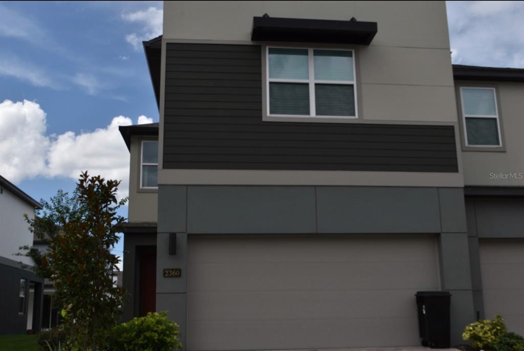 a view of house that has window in front of it