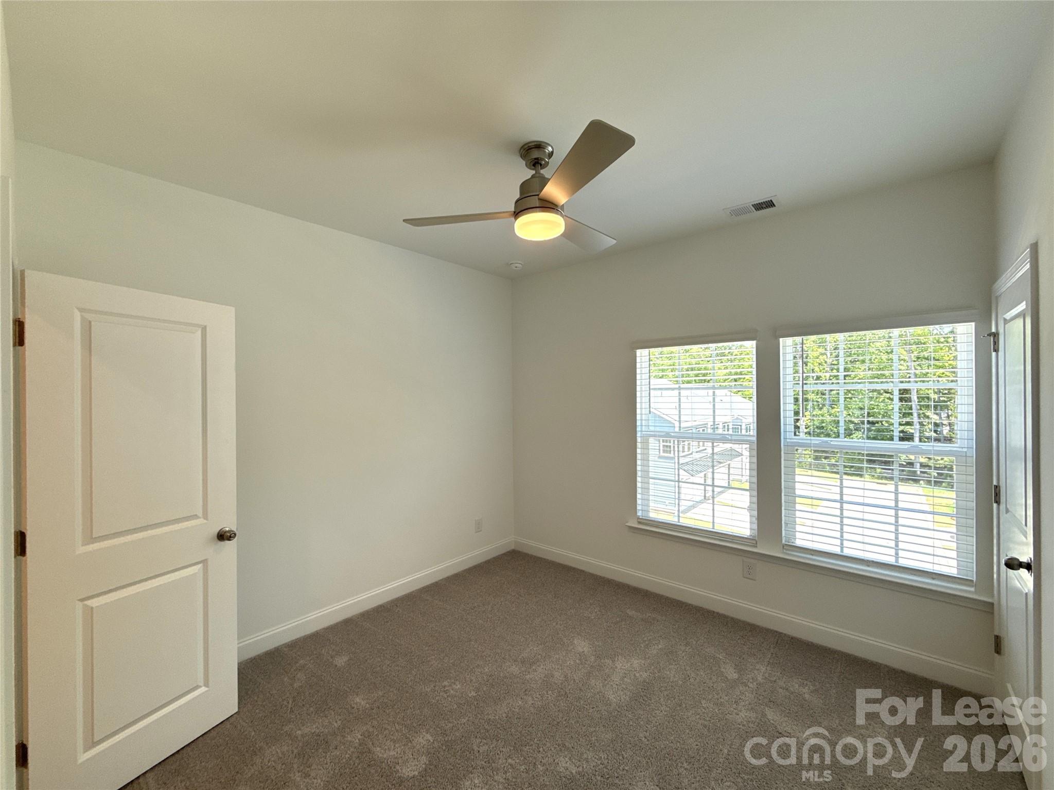 3220 Butler Hl Drive Matthews, NC 28105 - Photo 10 of 11 a view of an empty room with a window