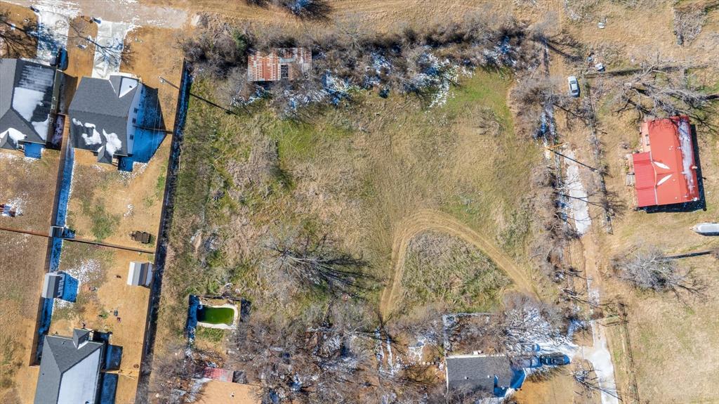 Tbd Pecan Street Tolar, TX 76476 - Photo 5 of 7 a aerial view of residential house with parking space