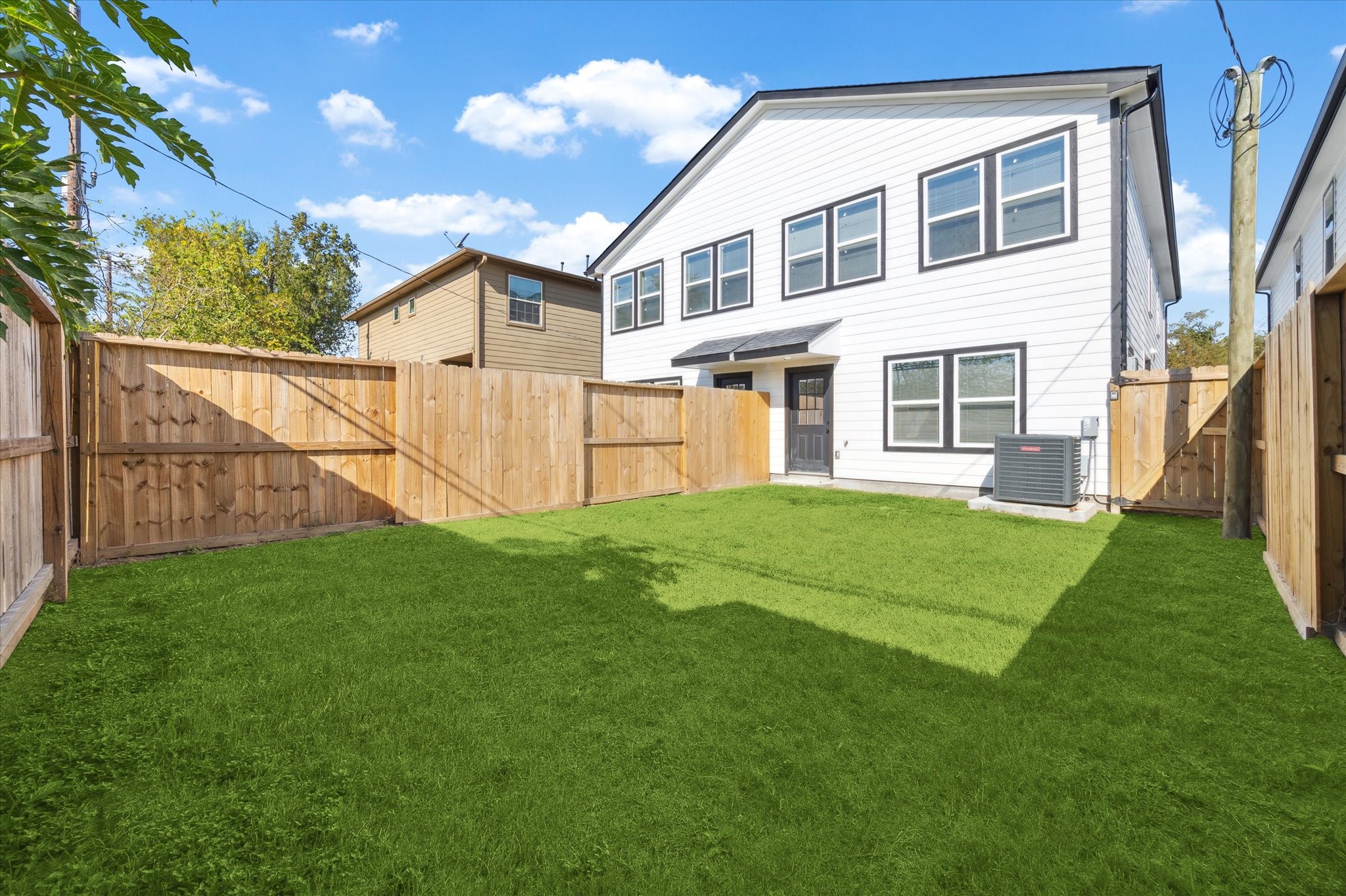9911 Porto Rico Road, Unit A Houston, TX 77041 - Photo 15 of 15 a view of a backyard with plants and large trees