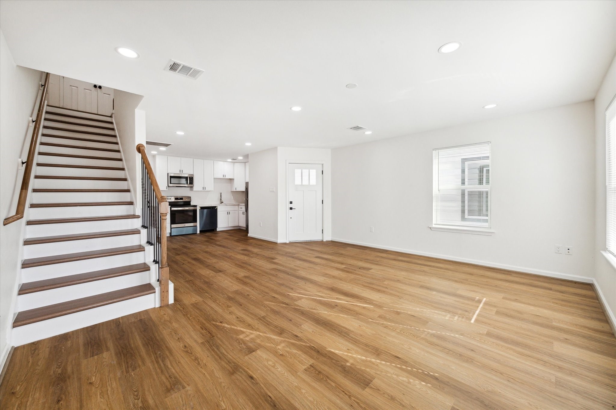 9911 Porto Rico Road, Unit A Houston, TX 77041 - Photo 5 of 15 a view of empty room with wooden floor