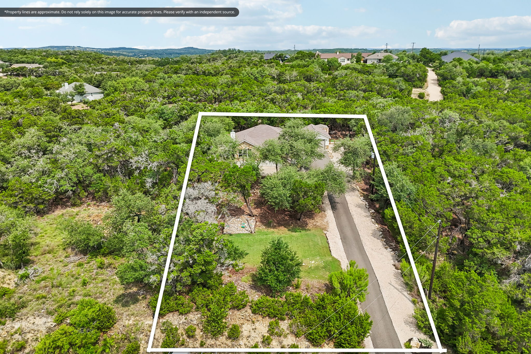 190 Magnolia Meadow Spring Branch, TX 78070 - Photo 23 of 29 An aerial perspective reveals a charming dwelling nestled amidst a lush, tree-filled landscape, offering a private and verdant setting.