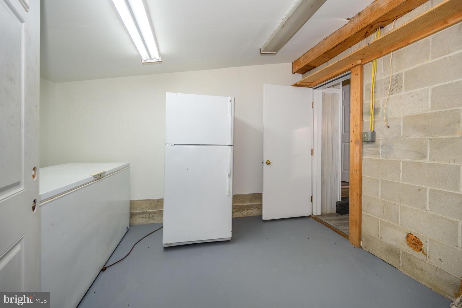 6746 Quaker Neck Road Chestertown, MD 21620 - Photo 34 of 50 a view of storage and utility room with washer and dryer