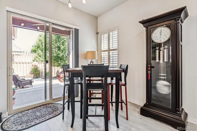 a view of a dining room with furniture and a window