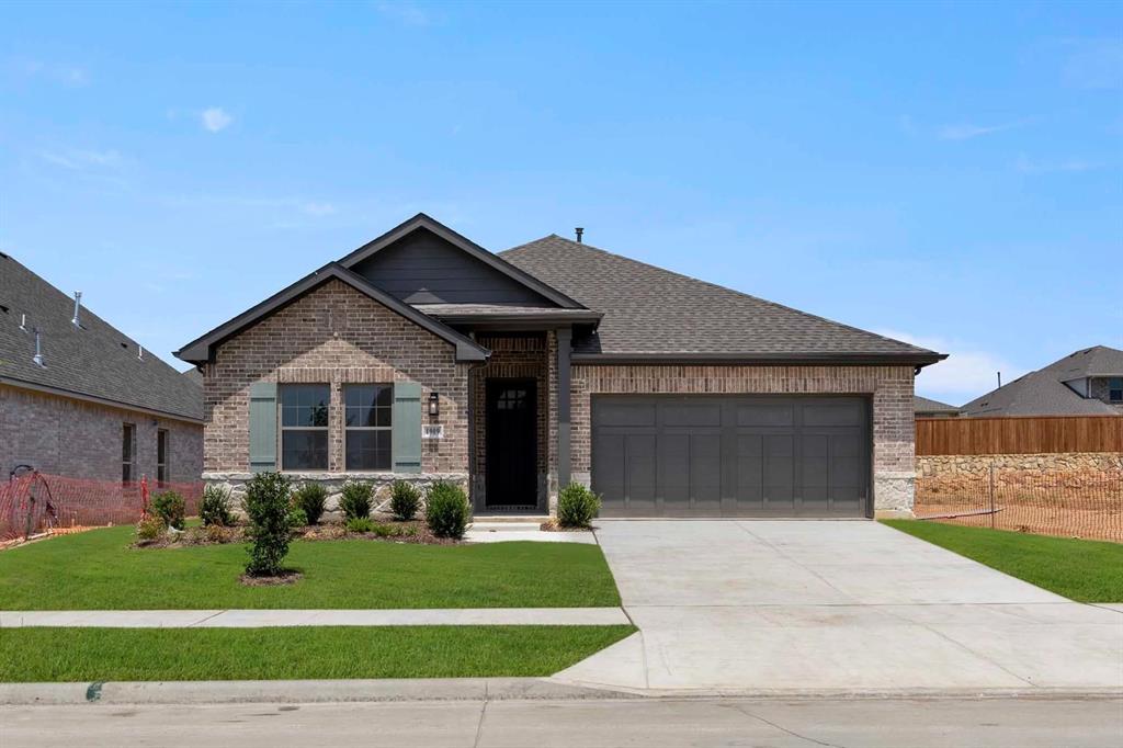 1909 Wishon Road Celina, TX 75009 - Photo 1 of 40 a front view of a house with a yard