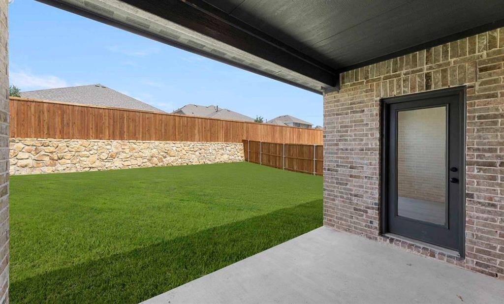 1909 Wishon Road Celina, TX 75009 - Photo 11 of 40 a view of a back yard of the house