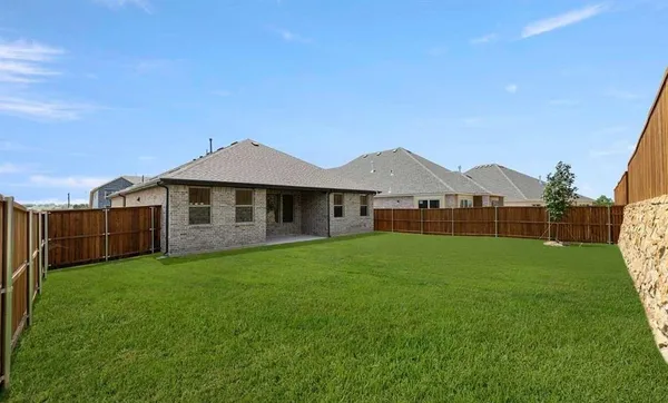 a view of a yard in front of a house