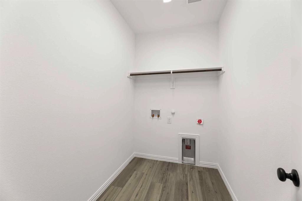 1909 Wishon Road Celina, TX 75009 - Photo 22 of 40 a view of a room with wooden floor