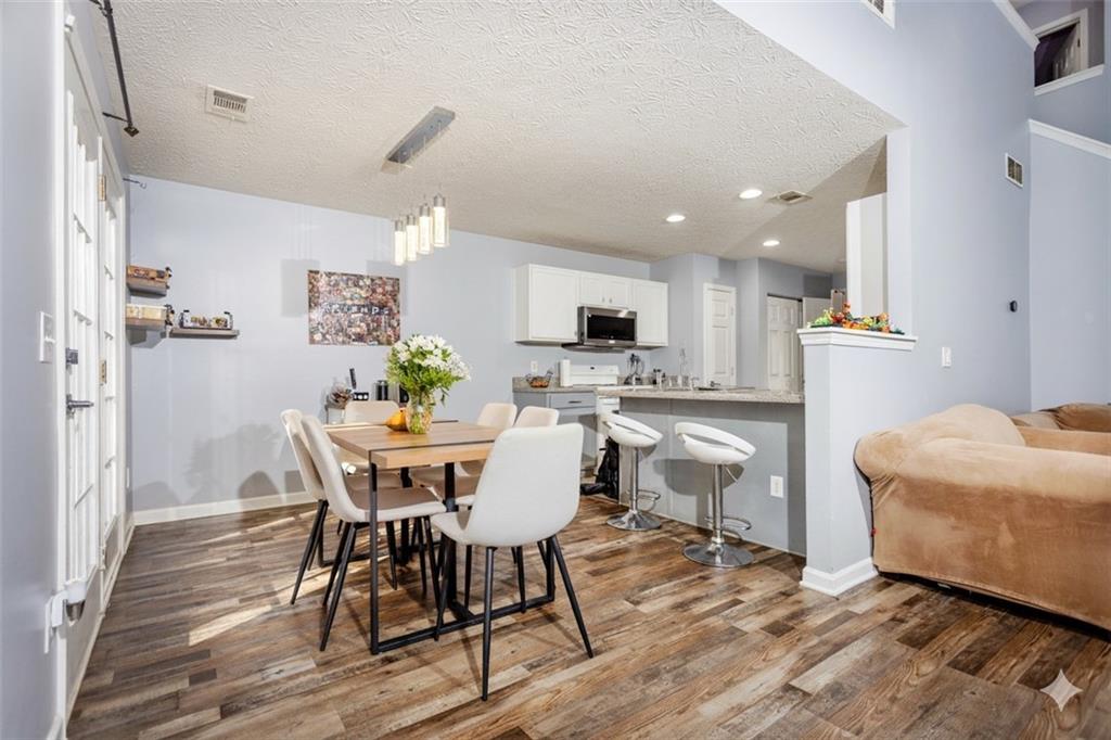 269 Silver Ridge Drive Dallas, GA 30157 - Photo 14 of 33 a view of a dining room with furniture and wooden floor